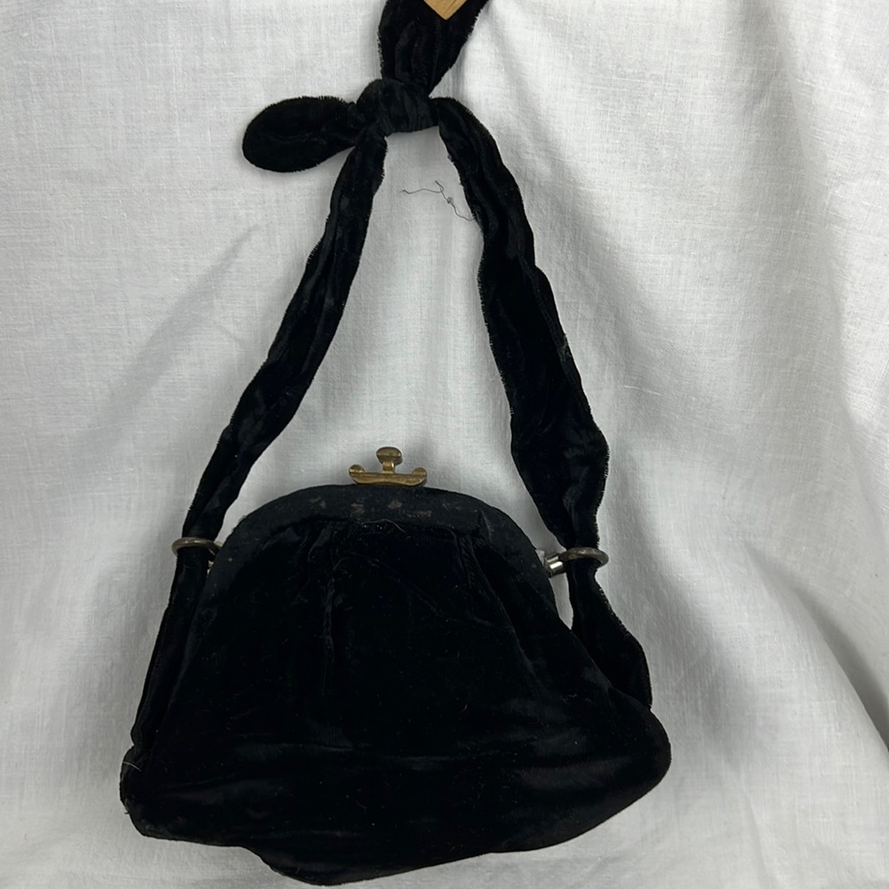 Old Vintage velvet clutch purse with gold latch closure.